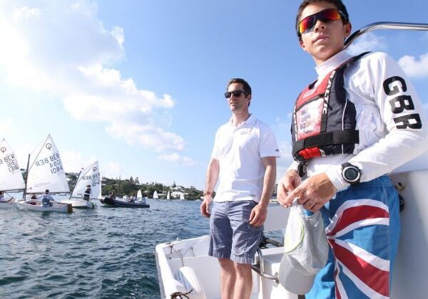 Sir Ben Ainslie and Milo Gill-Taylor, the UK National Optimist Champion, help to coach young sailors in Hamilton Harbour, Bermuda as part of the Andrew 'Bart' Simpson Clinic prior to the ARGO Group Gold Cup 2013. The Bart Clinic was recently set up to aid young sailors around the world.