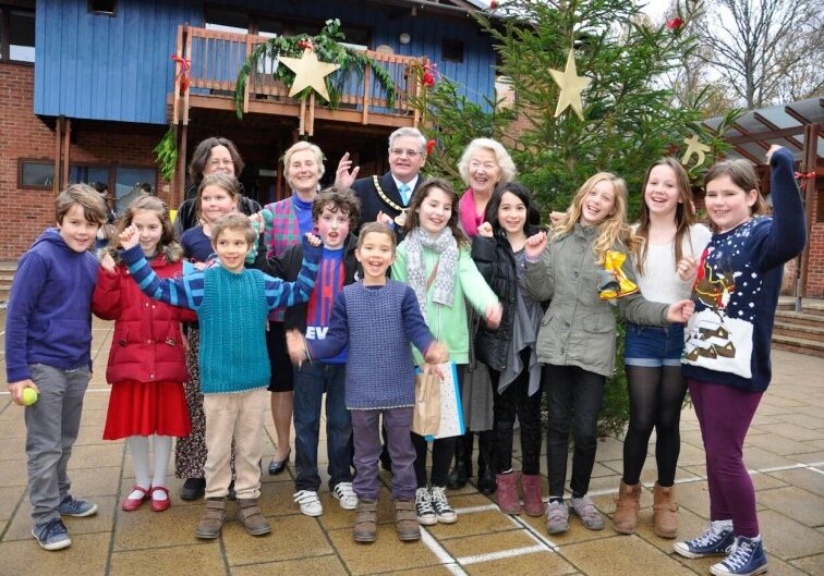 FESTIVE. Children welcome the Mayor and Mayoress in the courtyard at Ringwood Waldorf School